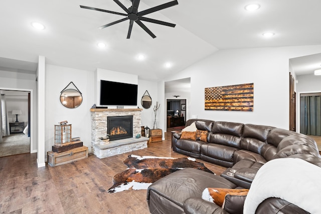 living room featuring a fireplace, dark hardwood / wood-style flooring, ceiling fan, and lofted ceiling