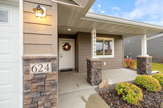 property entrance with covered porch