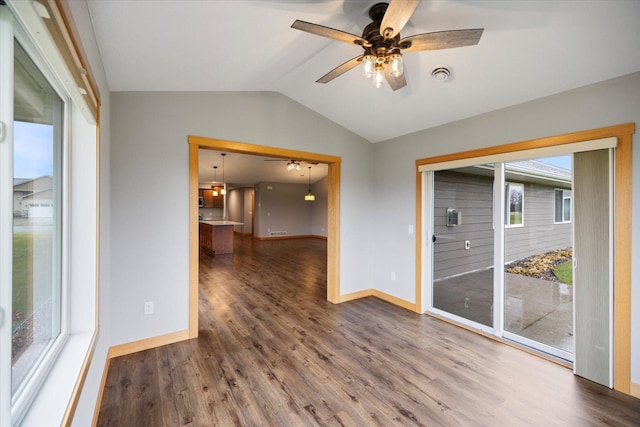 unfurnished room with ceiling fan, wood-type flooring, and vaulted ceiling