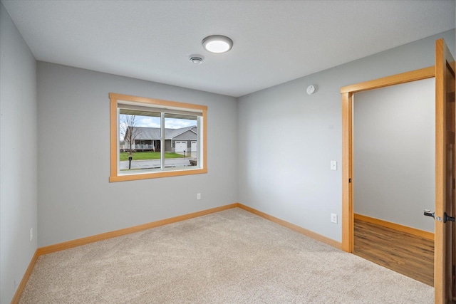 empty room featuring carpet flooring