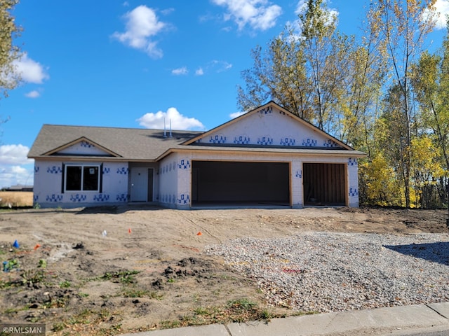 property under construction with a garage