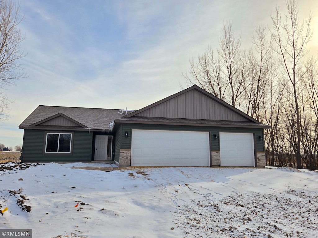 ranch-style home featuring a garage