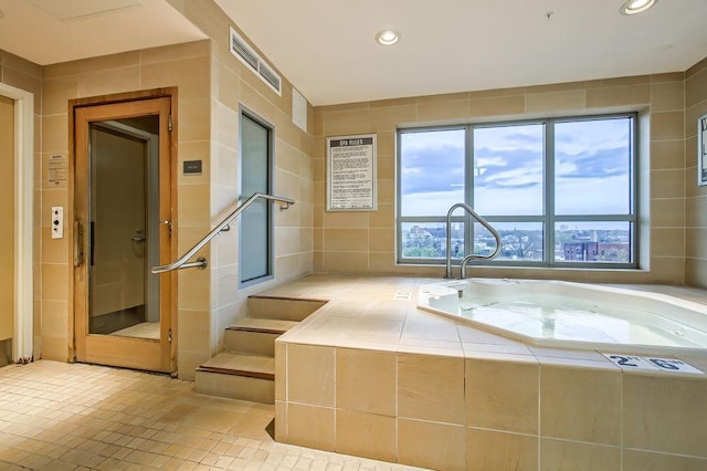 bathroom featuring tile walls and tile patterned floors