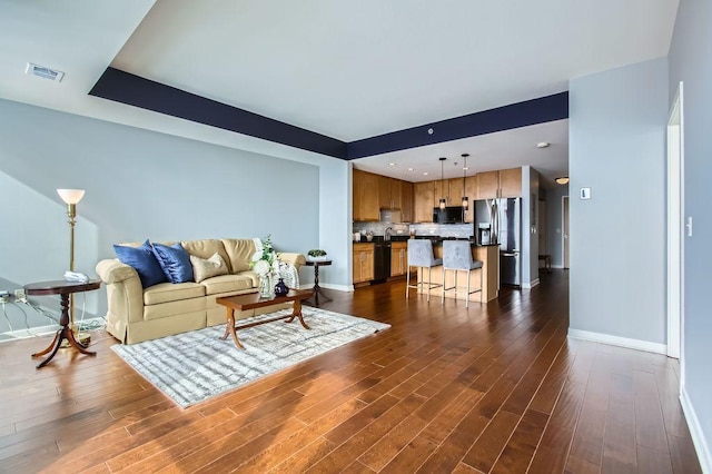 living room featuring dark hardwood / wood-style floors