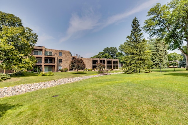 view of community featuring a lawn