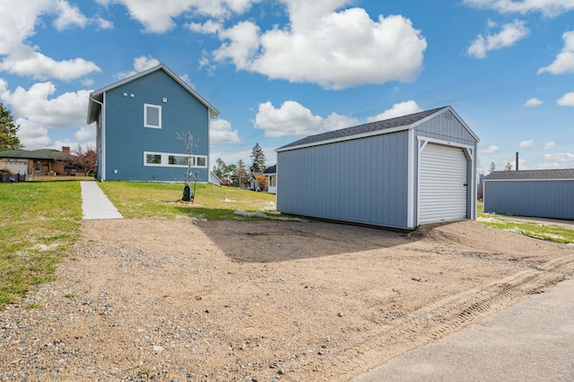 exterior space with a lawn and a garage