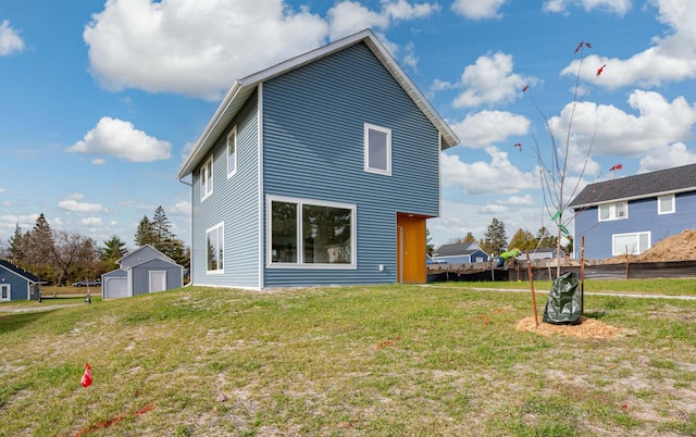 back of house featuring a yard