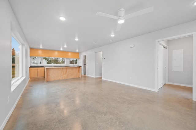 711 7th Ave, Grand Rapids, MN 55744 - unfurnished living room featuring finished concrete floors, recessed lighting, and ceiling fan