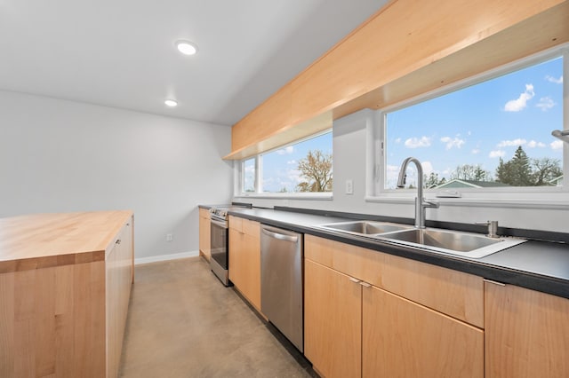 kitchen featuring butcher block counters, sink, stainless steel appliances, and light brown cabinets