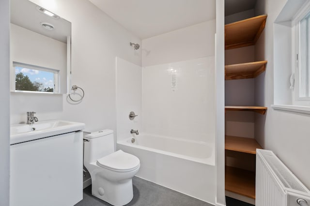 full bathroom featuring radiator heating unit, vanity, shower / bath combination, and toilet