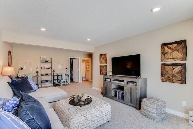 living area featuring baseboards, a textured ceiling, and light colored carpet