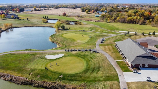 aerial view featuring view of golf course and a water view