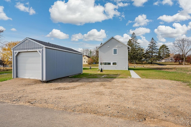 garage featuring a lawn