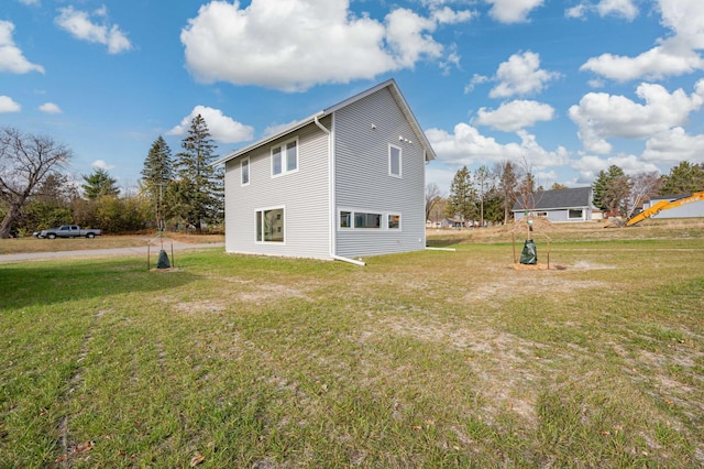 view of side of home featuring a yard