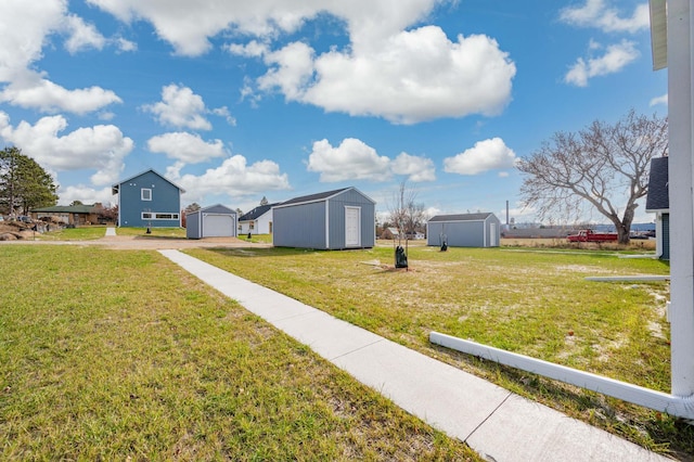 view of yard with an outdoor structure and a garage