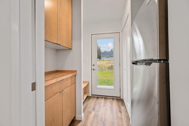 doorway with light wood-type flooring