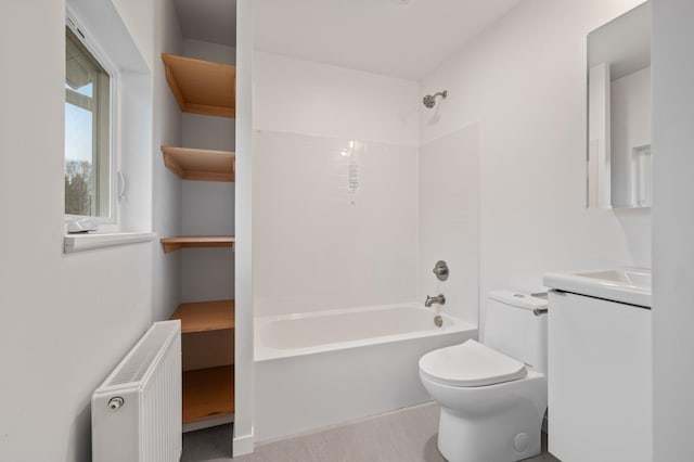 712 8th Ave, Grand Rapids, MN 55744 - bathroom with radiator, vanity, and washtub / shower combination