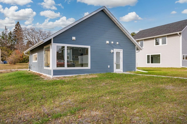 back of house featuring a yard