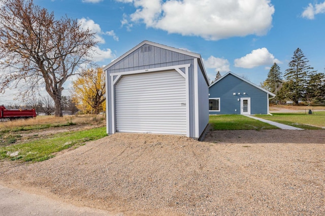 garage featuring a lawn