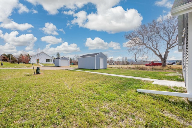 view of yard with an outdoor structure and a garage