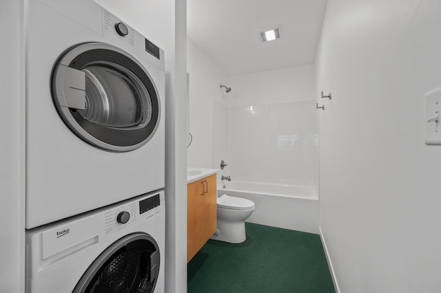 laundry area with carpet and stacked washer / drying machine