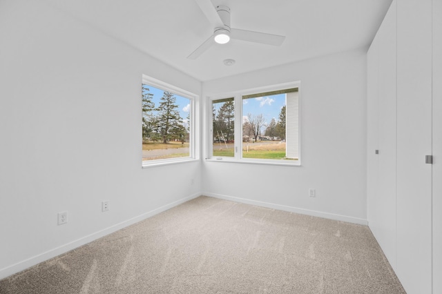 unfurnished room featuring carpet flooring and ceiling fan