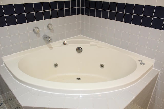 bathroom with tiled bath