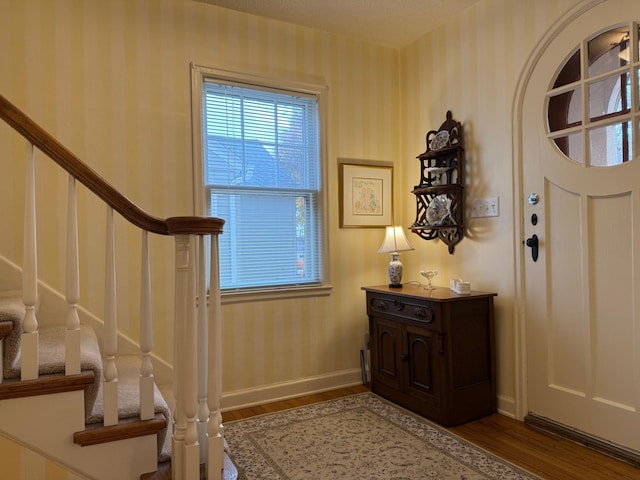 foyer entrance featuring wood-type flooring