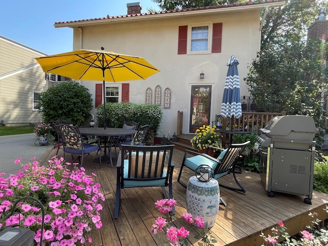 wooden terrace featuring grilling area