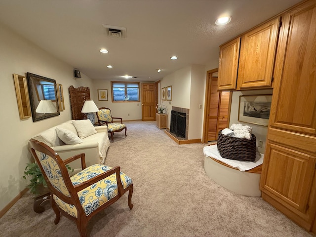 carpeted living room with a fireplace