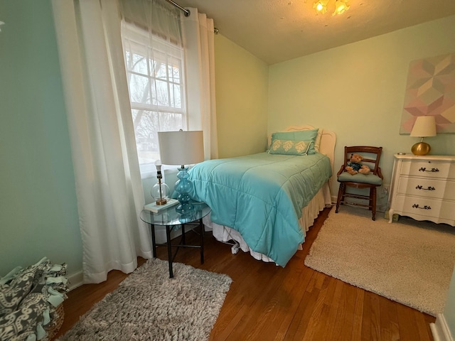 bedroom featuring dark wood-type flooring