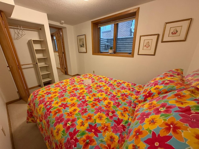 carpeted bedroom with a textured ceiling