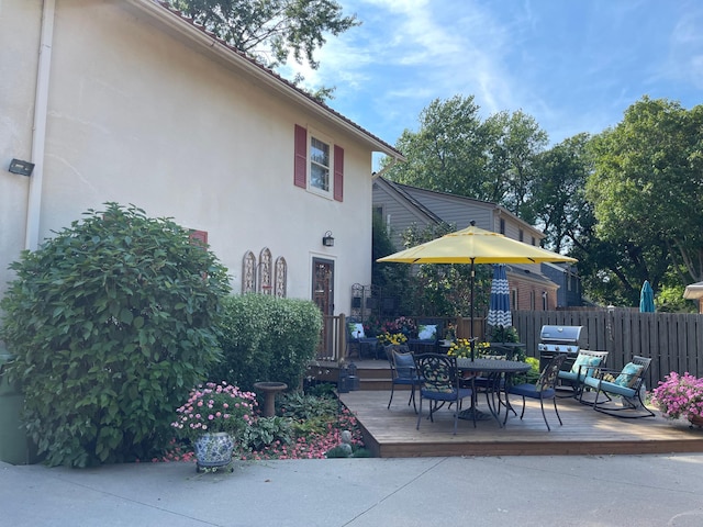 607 Lake Ave, Worthington, MN 56187 - view of patio with a wooden deck, outdoor dining space, and area for grilling