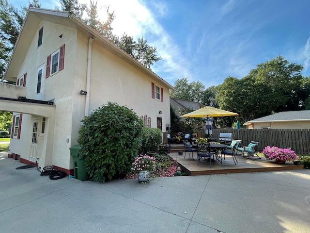 607 Lake Ave, Worthington, MN 56187 - view of patio featuring outdoor dining space and a wooden deck