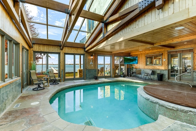 view of pool featuring a skylight