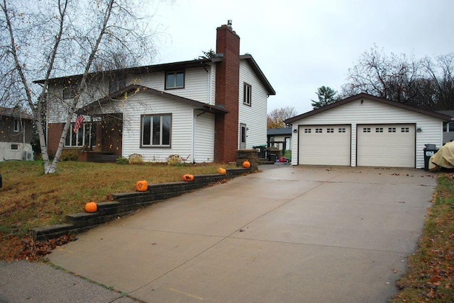 view of side of home with an outdoor structure and a garage