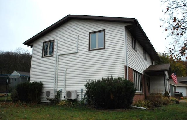 view of home's exterior with ac unit