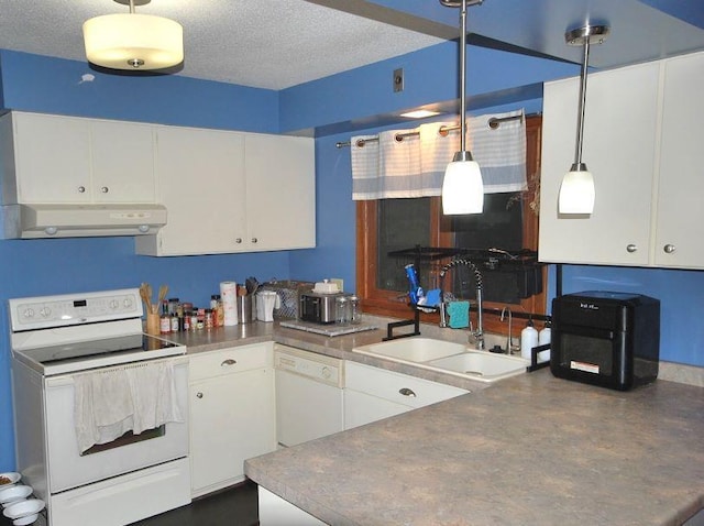 kitchen with white cabinetry, pendant lighting, sink, ventilation hood, and white appliances