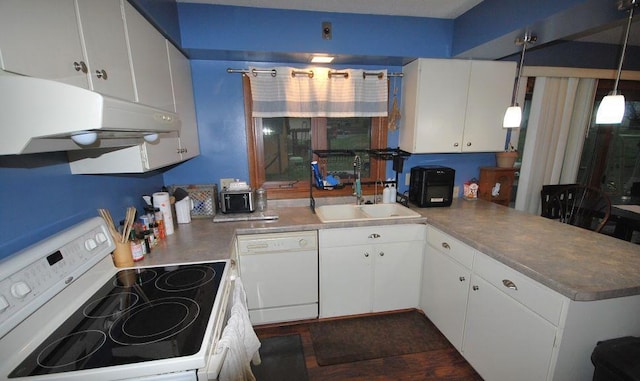 kitchen with white appliances, sink, kitchen peninsula, hanging light fixtures, and white cabinetry