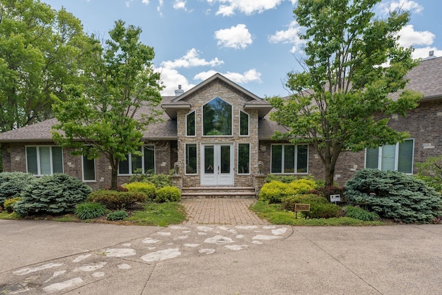 5441 Raven Point Rd, Spring Lake Twp, MN 55372 - view of front of home with brick siding, roof with shingles, and french doors