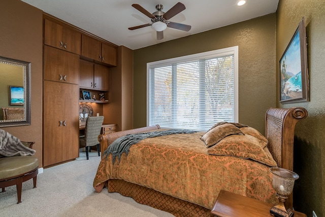 5441 Raven Point Rd, Spring Lake Twp, MN 55372 - bedroom with light carpet, a textured wall, and a ceiling fan