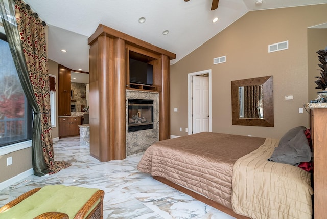 5441 Raven Point Rd, Spring Lake Twp, MN 55372 - bedroom with a glass covered fireplace, light marble finish flooring, baseboards, recessed lighting, and high vaulted ceiling