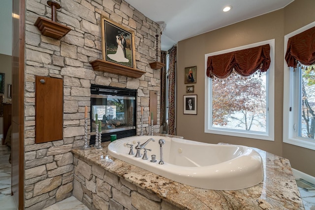 5441 Raven Point Rd, Spring Lake Twp, MN 55372 - bathroom featuring a jetted tub and a fireplace