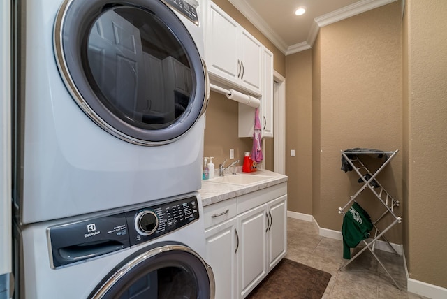 5441 Raven Point Rd, Spring Lake Twp, MN 55372 - washroom featuring stacked washer and clothes dryer, ornamental molding, cabinet space, light tile patterned floors, and baseboards
