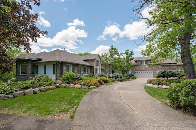 5441 Raven Point Rd, Spring Lake Twp, MN 55372 - view of front of house featuring asphalt driveway, an attached garage, brick siding, and a front lawn