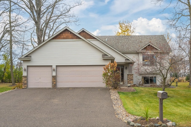 view of front of home featuring a garage and a front yard