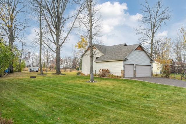 exterior space with a garage and a yard