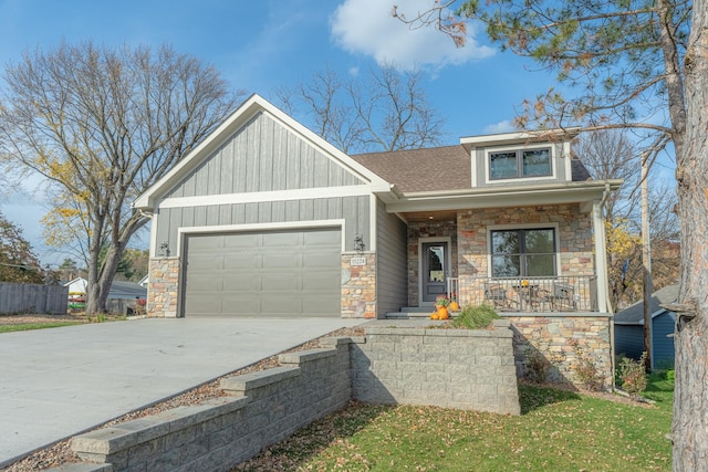 view of front of property with a porch and a garage