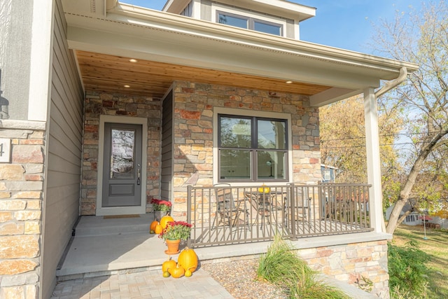 doorway to property featuring covered porch