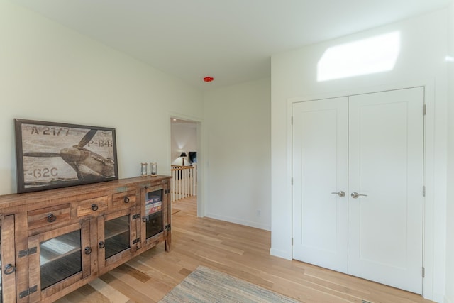 hall with light hardwood / wood-style floors